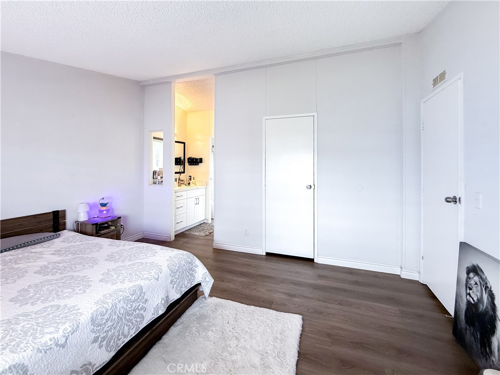 1855 East Riverside, Unit 130 Ontario, CA 91761 - Photo 41 of 62 a bedroom with a bed and a dresser