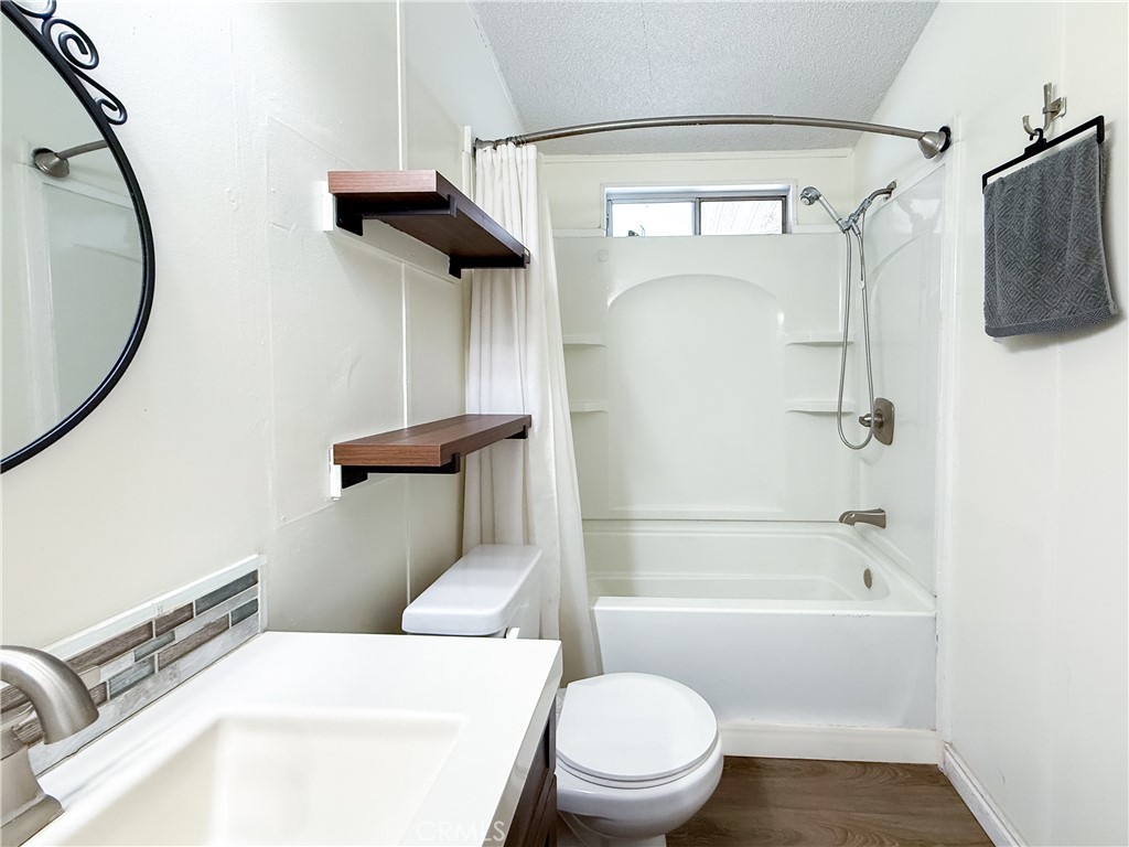 1855 East Riverside, Unit 130 Ontario, CA 91761 - Photo 45 of 62 a bathroom with a toilet and a shower