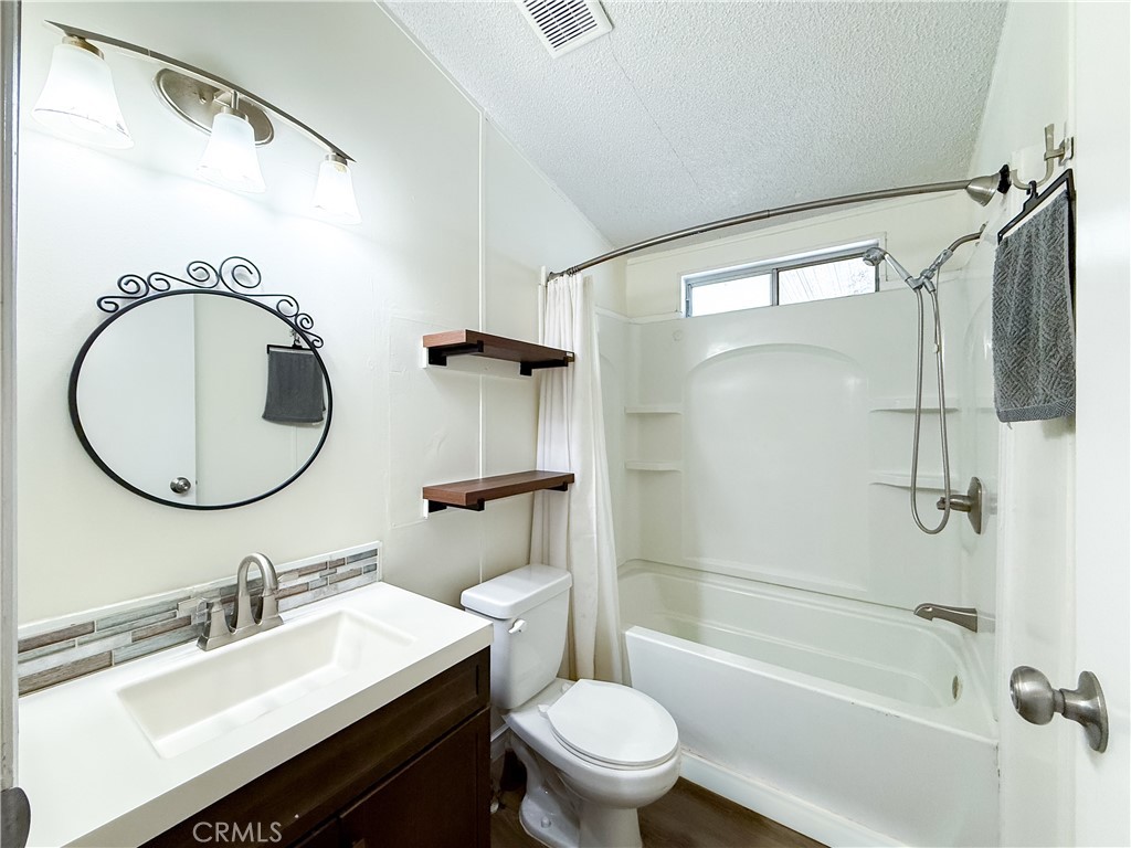 1855 East Riverside, Unit 130 Ontario, CA 91761 - Photo 47 of 62 a bathroom with a sink toilet and shower