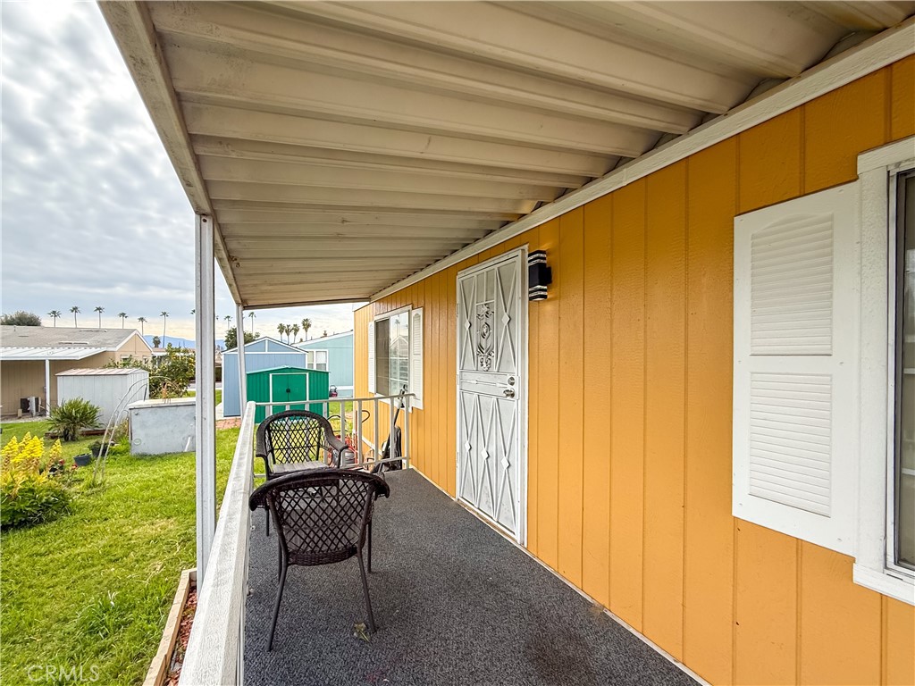 1855 East Riverside, Unit 130 Ontario, CA 91761 - Photo 5 of 62 a balcony with furniture and garden view