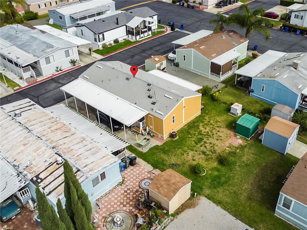 1855 East Riverside, Unit 130 Ontario, CA 91761 - Photo 56 of 62 an aerial view of a house with a yard