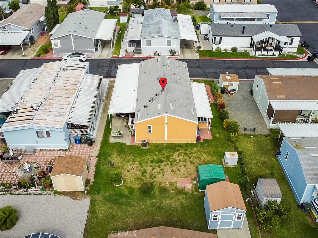 1855 East Riverside, Unit 130 Ontario, CA 91761 - Photo 7 of 62 an aerial view of residential houses with outdoor space and parking
