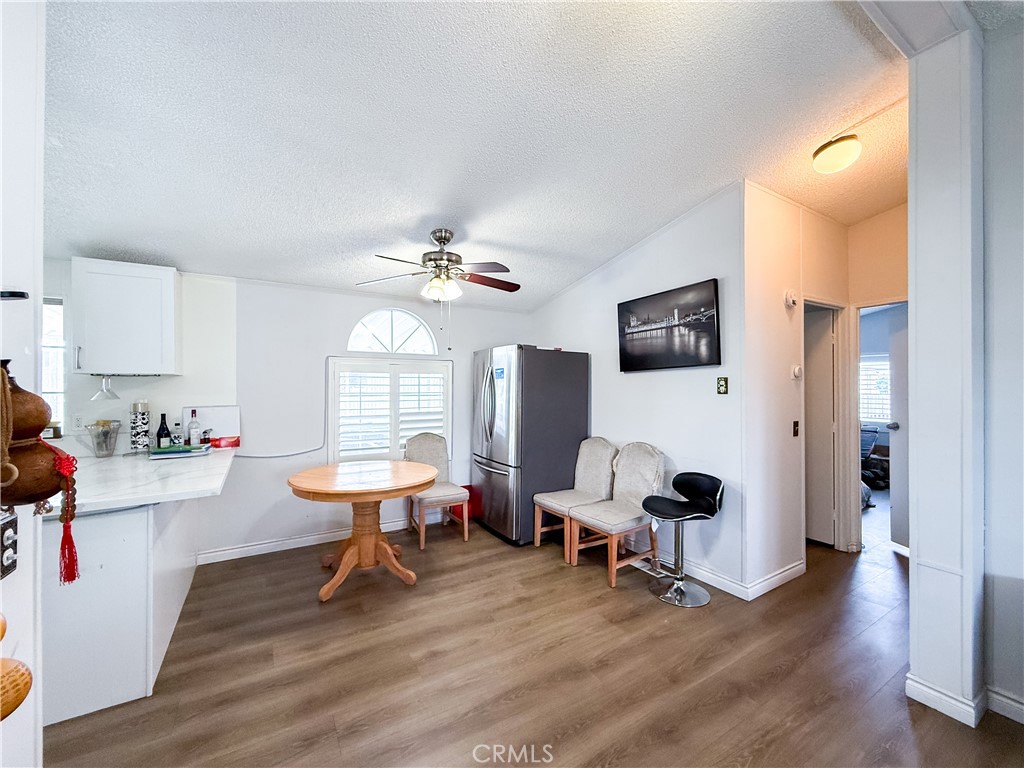 1855 East Riverside, Unit 130 Ontario, CA 91761 - Photo 10 of 62 a living room with furniture and wooden floor