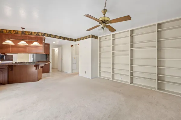 a view of a room with cabinet and mirrors