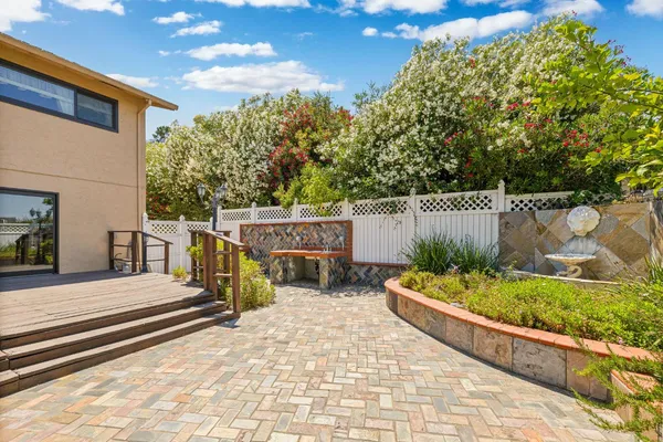 a view of a backyard with sitting area