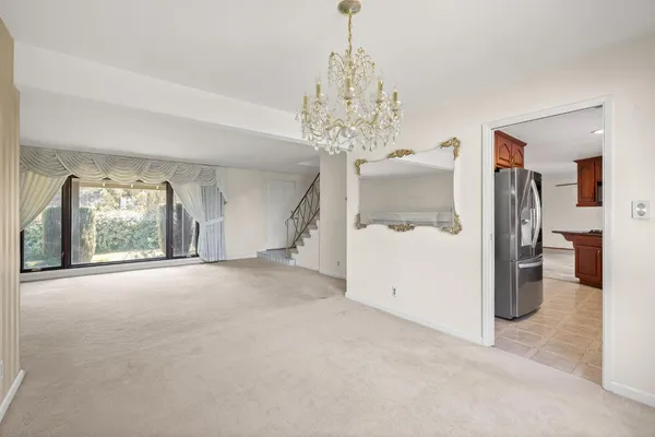 a view of a chandelier and a chandelier in a room