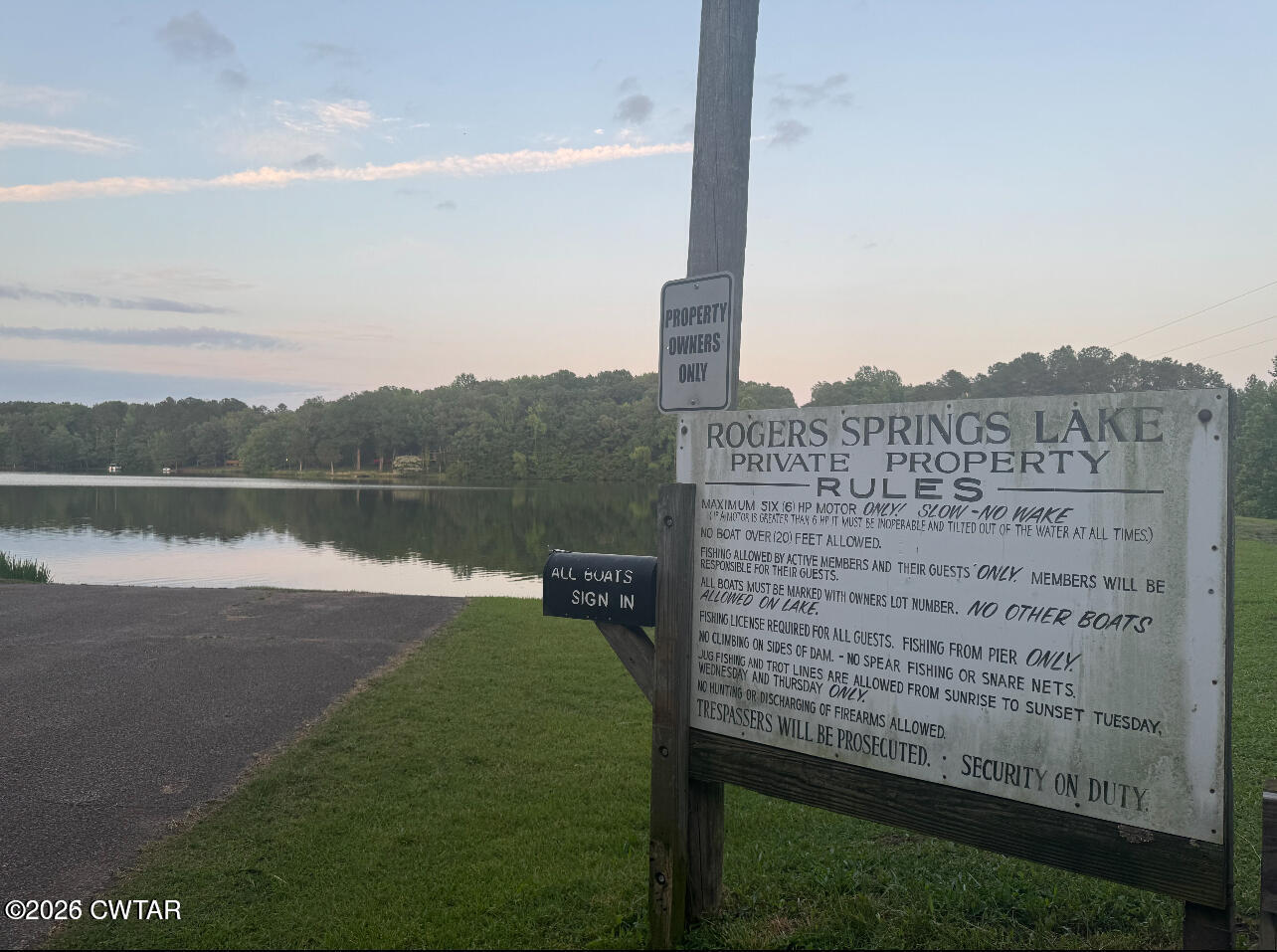 160 Oak Grove Road Middleton, TN 38052 - Photo 2 of 13 a view of a lake with a big yard and large trees
