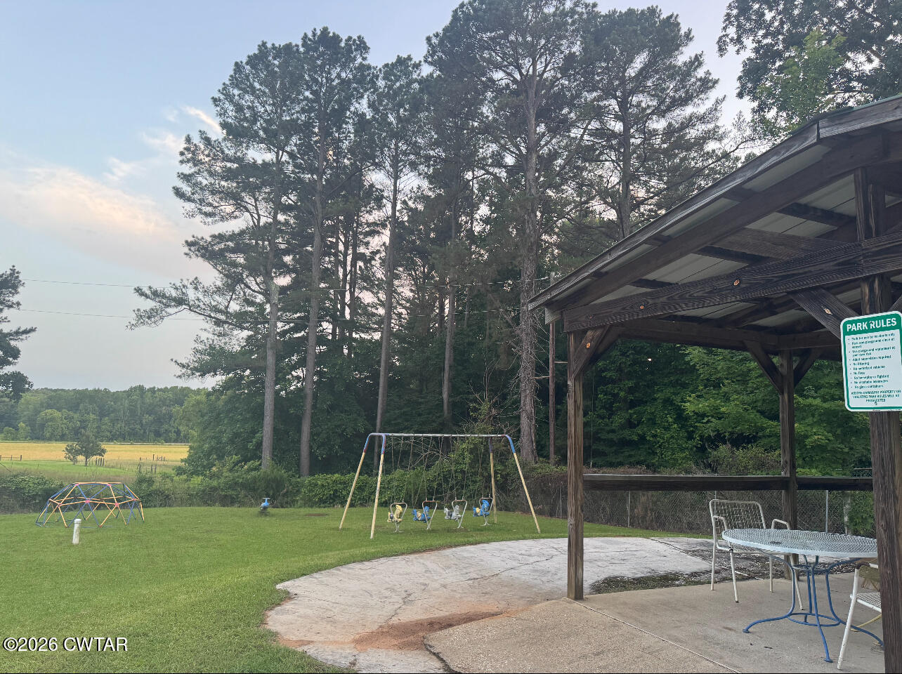 160 Oak Grove Road Middleton, TN 38052 - Photo 10 of 13 a backyard of a house with lots of green space and fountain