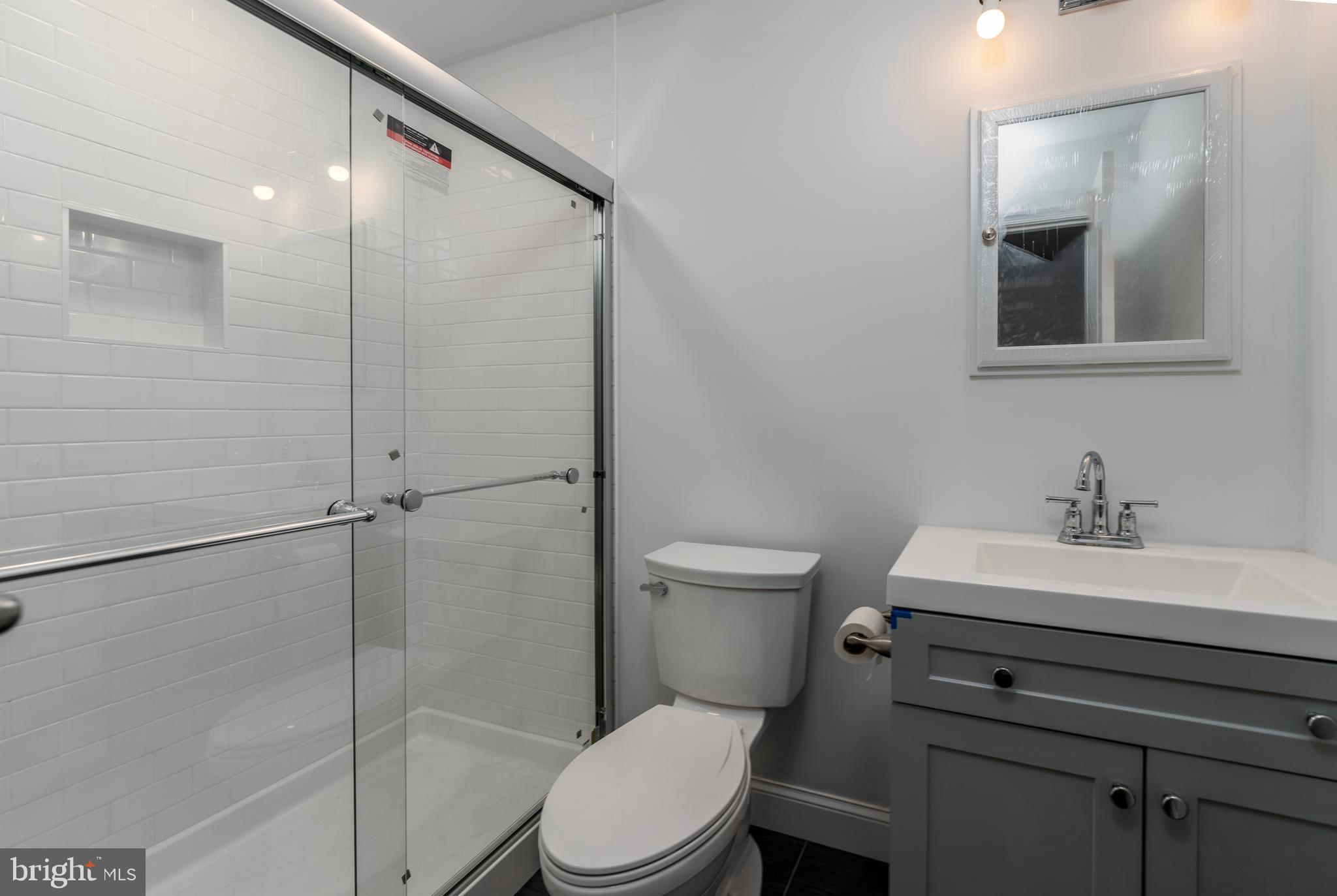 1153 Riverside Avenue Baltimore, MD 21230 - Photo 11 of 35 a bathroom with a sink toilet and shower