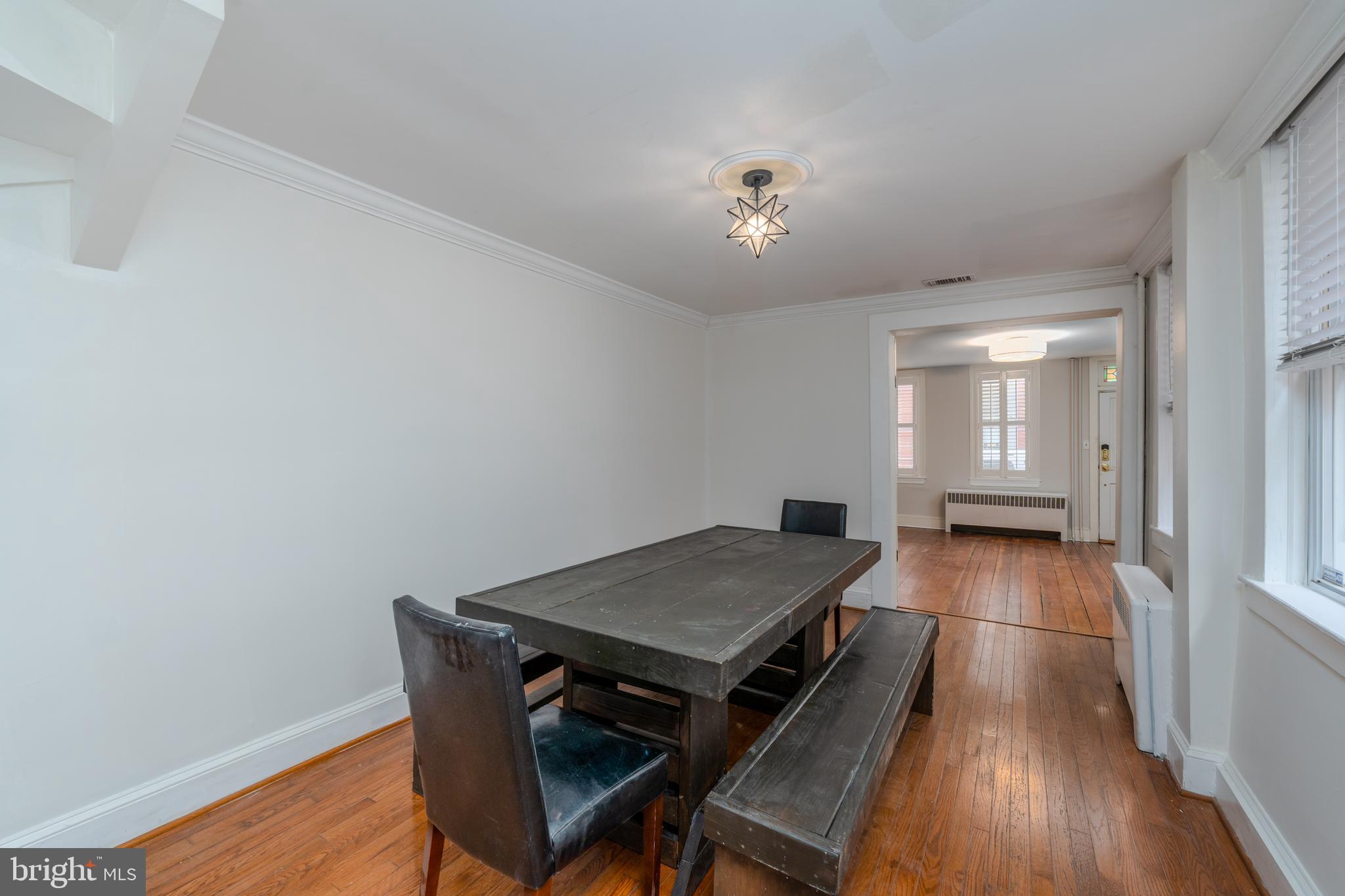 1153 Riverside Avenue Baltimore, MD 21230 - Photo 6 of 35 a view of a room with wooden floor and staircase