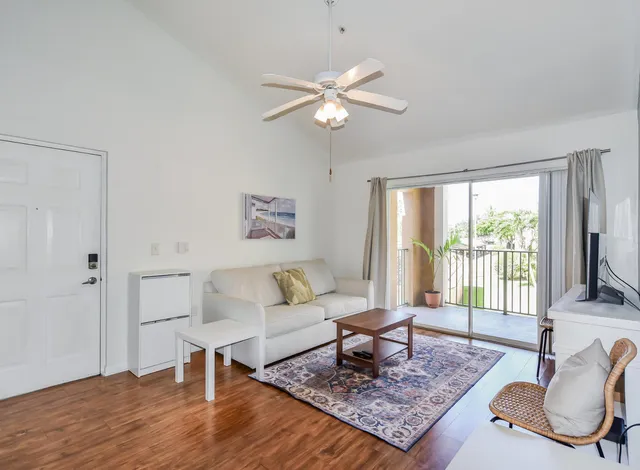 a living room with furniture rug and window