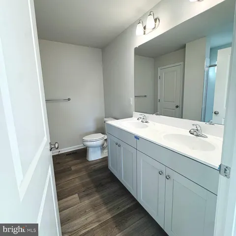 a bathroom with a glass shower door