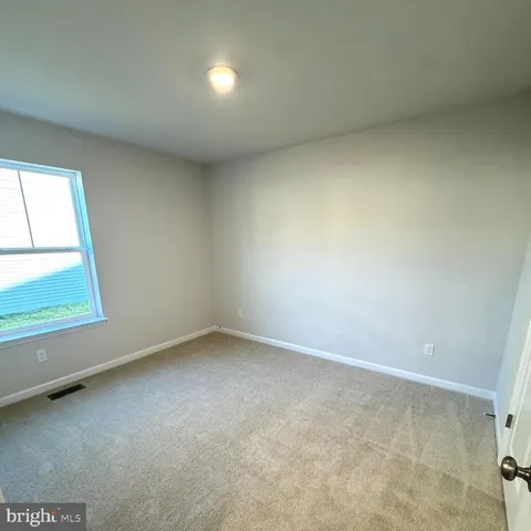 a bathroom with a granite countertop toilet a sink and a shower