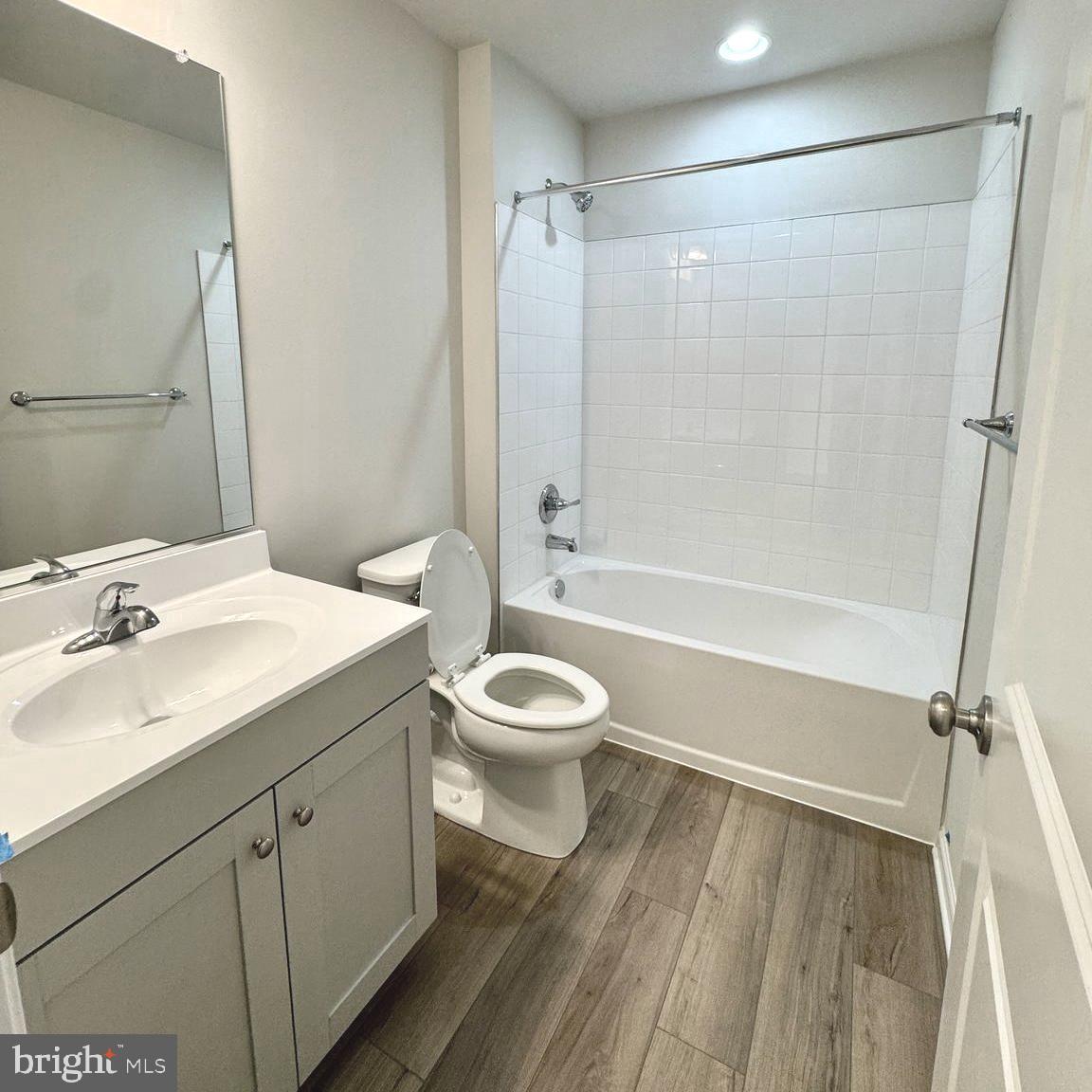 730 R Wilson Loop Georgetown, DE 19947 - Photo 16 of 24 a bathroom with a granite countertop toilet a sink and a shower