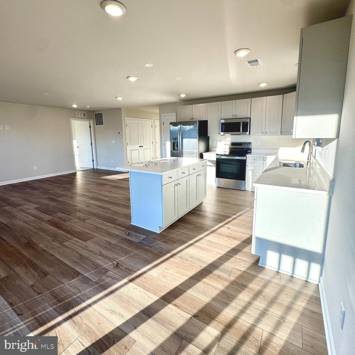 730 R Wilson Loop Georgetown, DE 19947 - Photo 6 of 24 a living room with furniture and a wooden floor