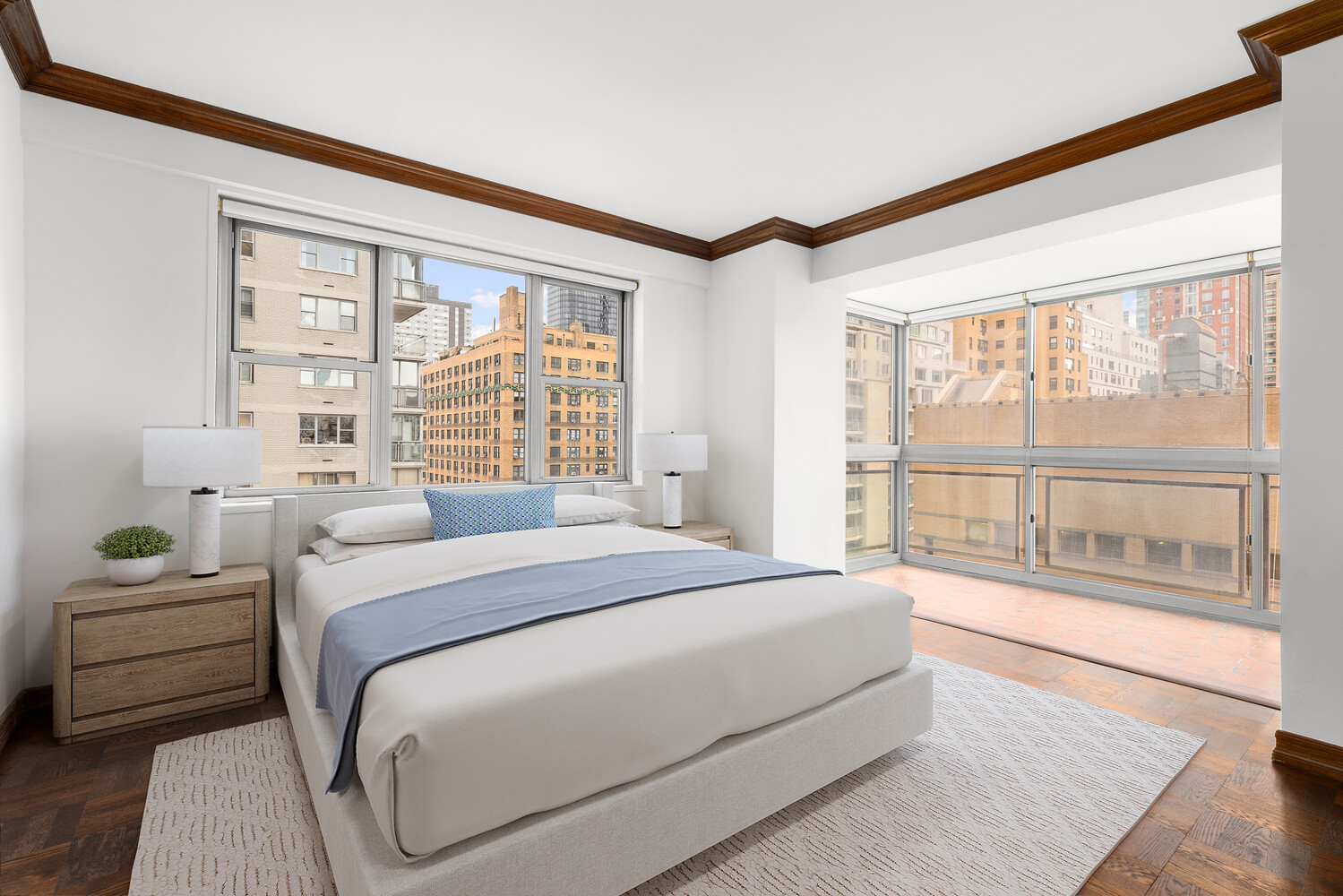 150 East 69th Street, Unit 11L Manhattan, NY 10021 - Photo 10 of 13 a bedroom with a large bed and a large window with outer view