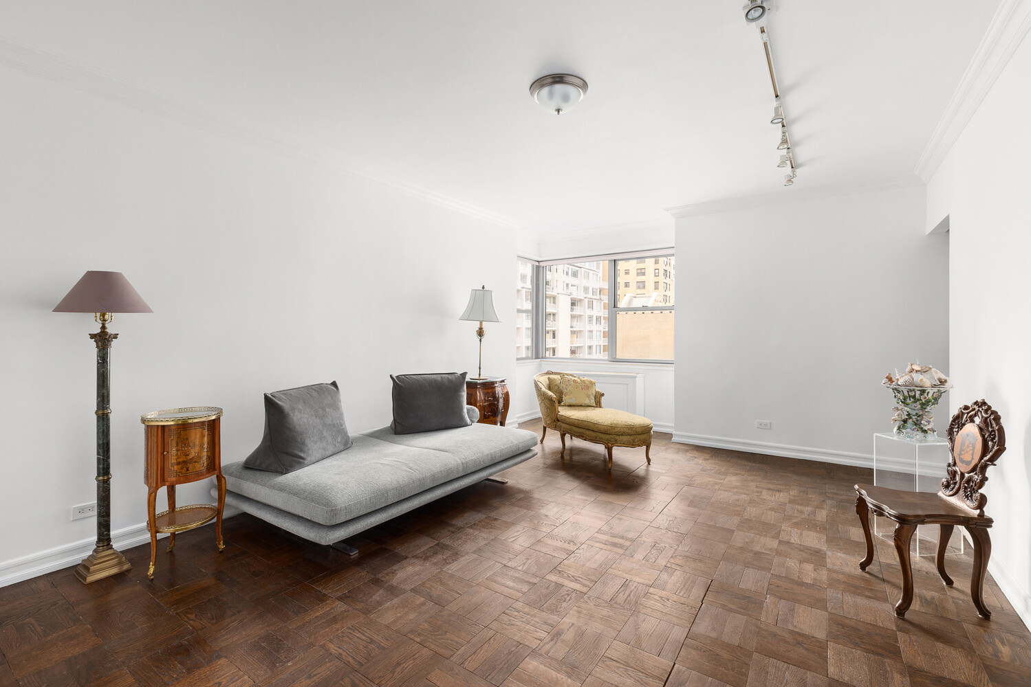 150 East 69th Street, Unit 11L Manhattan, NY 10021 - Photo 8 of 13 a living room with furniture and a window
