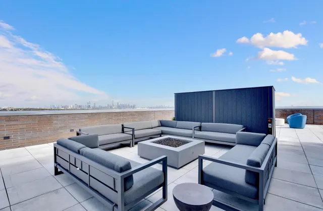 a outdoor living space with furniture and city view