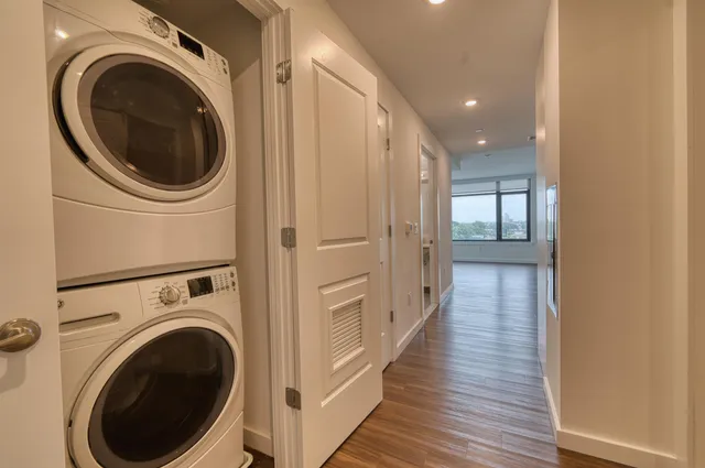 a view of a hallway with washer and dryer