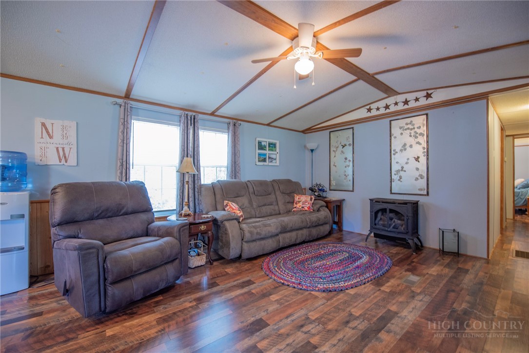 1848 West Mill Creek Road Warrensville, NC 28693 - Photo 11 of 50 a living room with furniture and a fireplace