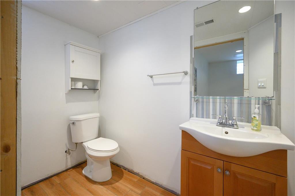 532 Oregon Avenue Rochester, PA 15074 - Photo 18 of 25 a bathroom with a sink toilet and a mirror