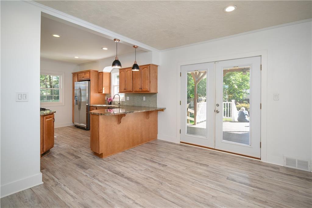 532 Oregon Avenue Rochester, PA 15074 - Photo 6 of 25 a kitchen with stainless steel appliances a refrigerator and wooden floor