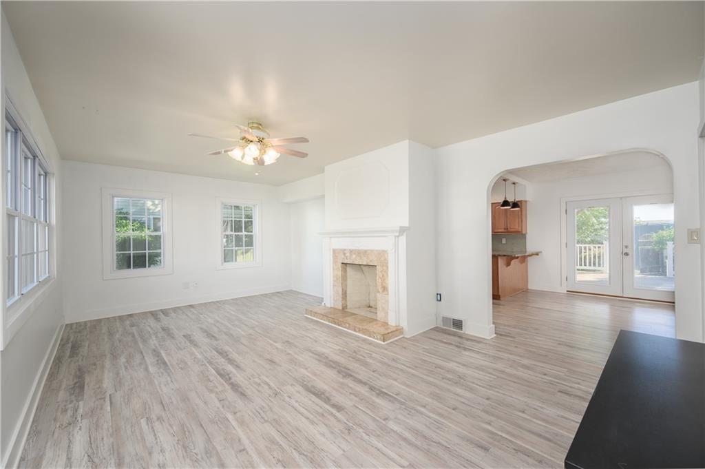 532 Oregon Avenue Rochester, PA 15074 - Photo 7 of 25 a view of an empty room with window and wooden floor
