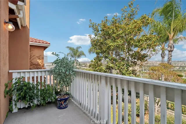 a view of a wooden fence and trees