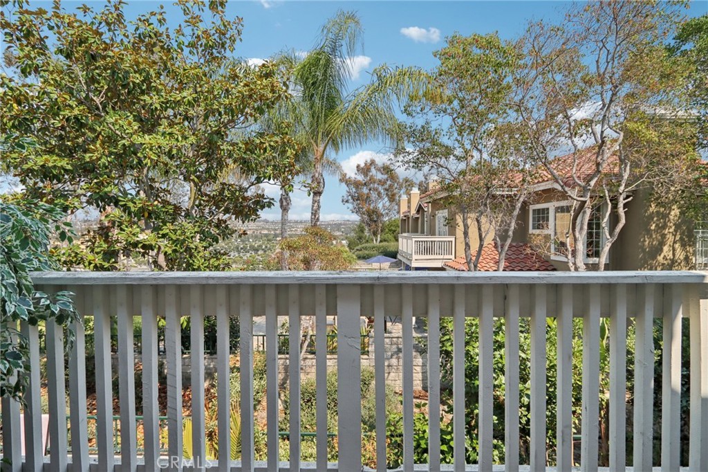 87 Matisse Circle, Unit CI42 Aliso Viejo, CA 92656 - Photo 12 of 19 a view of a wooden fence and trees