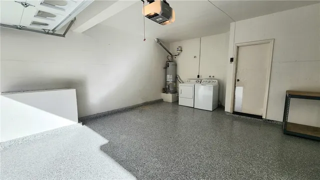 an aerial view of a house with garden space and street view