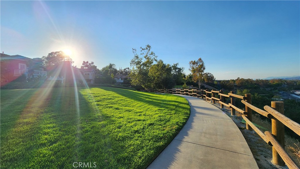 87 Matisse Circle, Unit CI42 Aliso Viejo, CA 92656 - Photo 18 of 19 a view of a lake with a garden