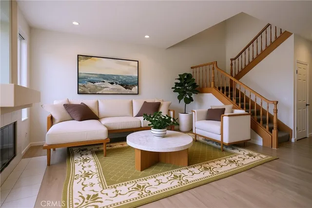 a living room with furniture and a rug