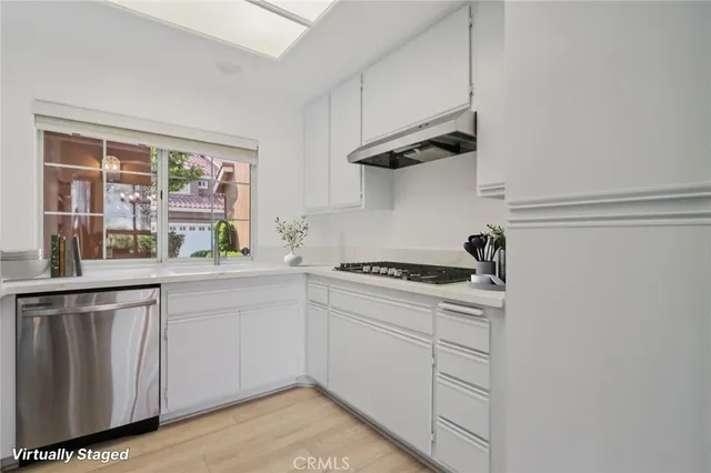 a kitchen with a stove and a sink
