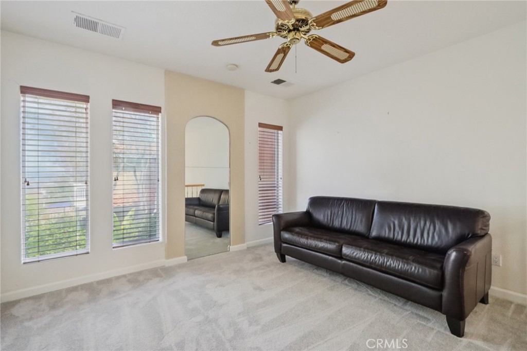 87 Matisse Circle, Unit CI42 Aliso Viejo, CA 92656 - Photo 10 of 19 a living room with furniture and a fireplace