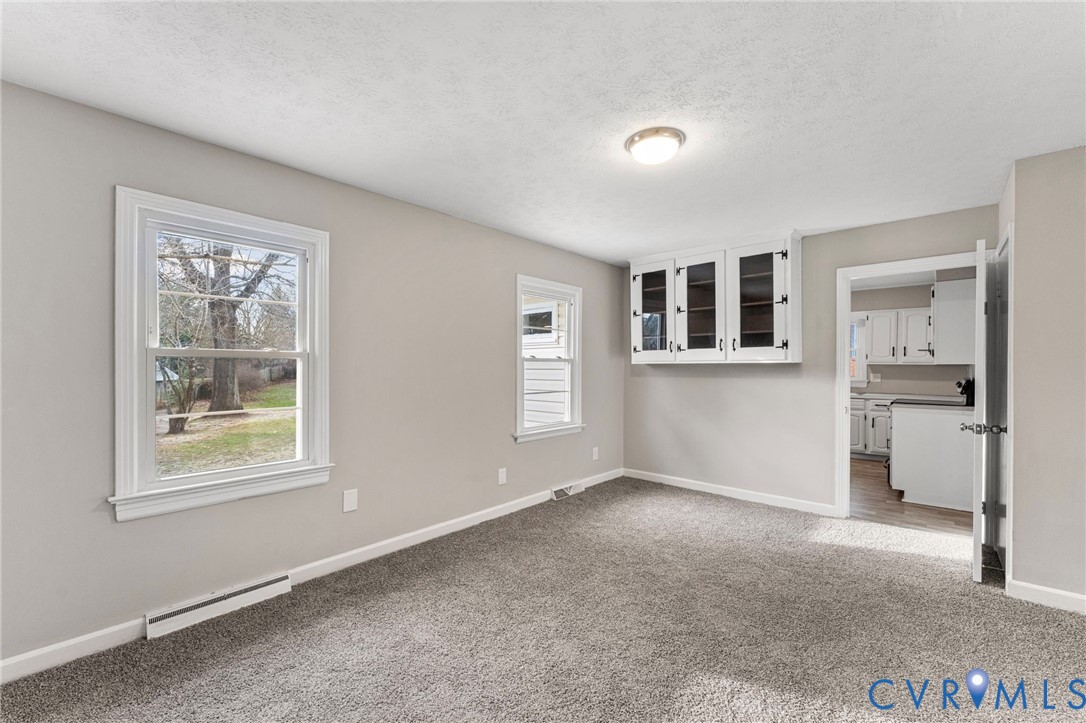 159 2nd Street Appomattox, VA 24522 - Photo 14 of 30 a view of livingroom with workspace and windows