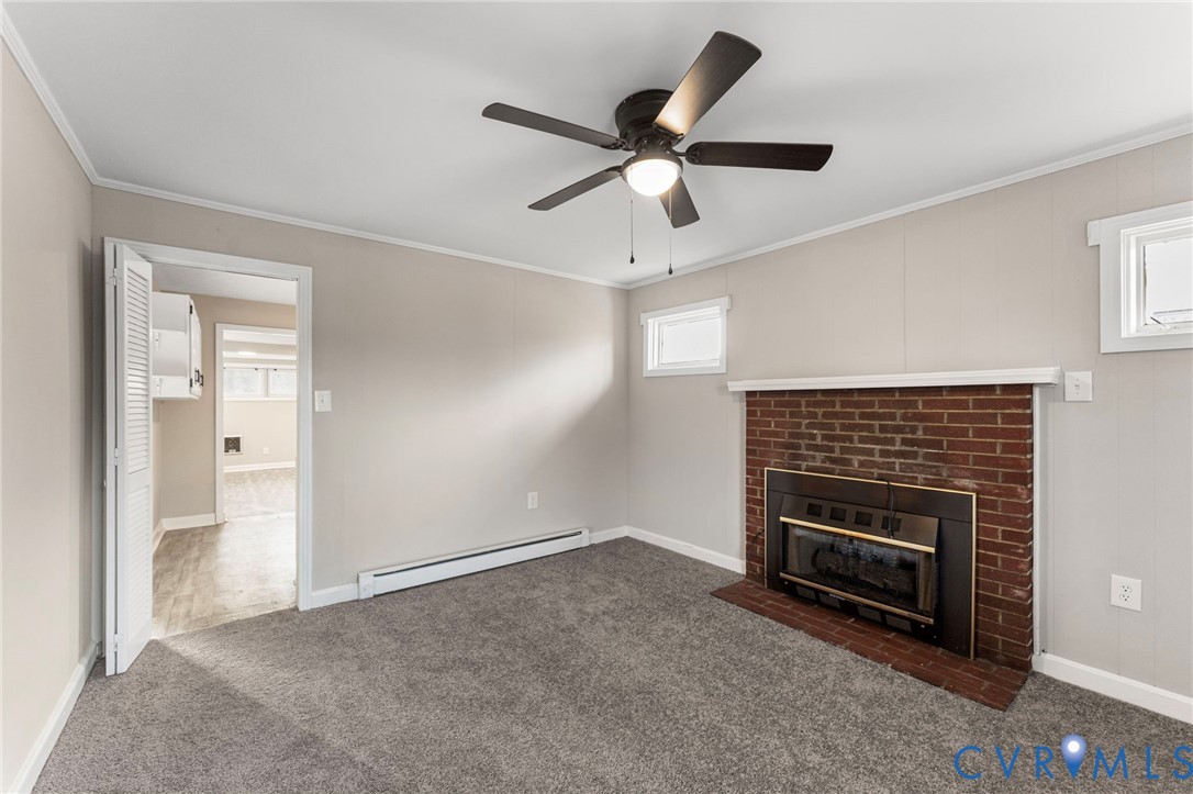 159 2nd Street Appomattox, VA 24522 - Photo 6 of 30 a living room with stainless steel appliances wooden floor and a ceiling fan