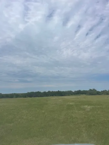 a view of a houses with a yard