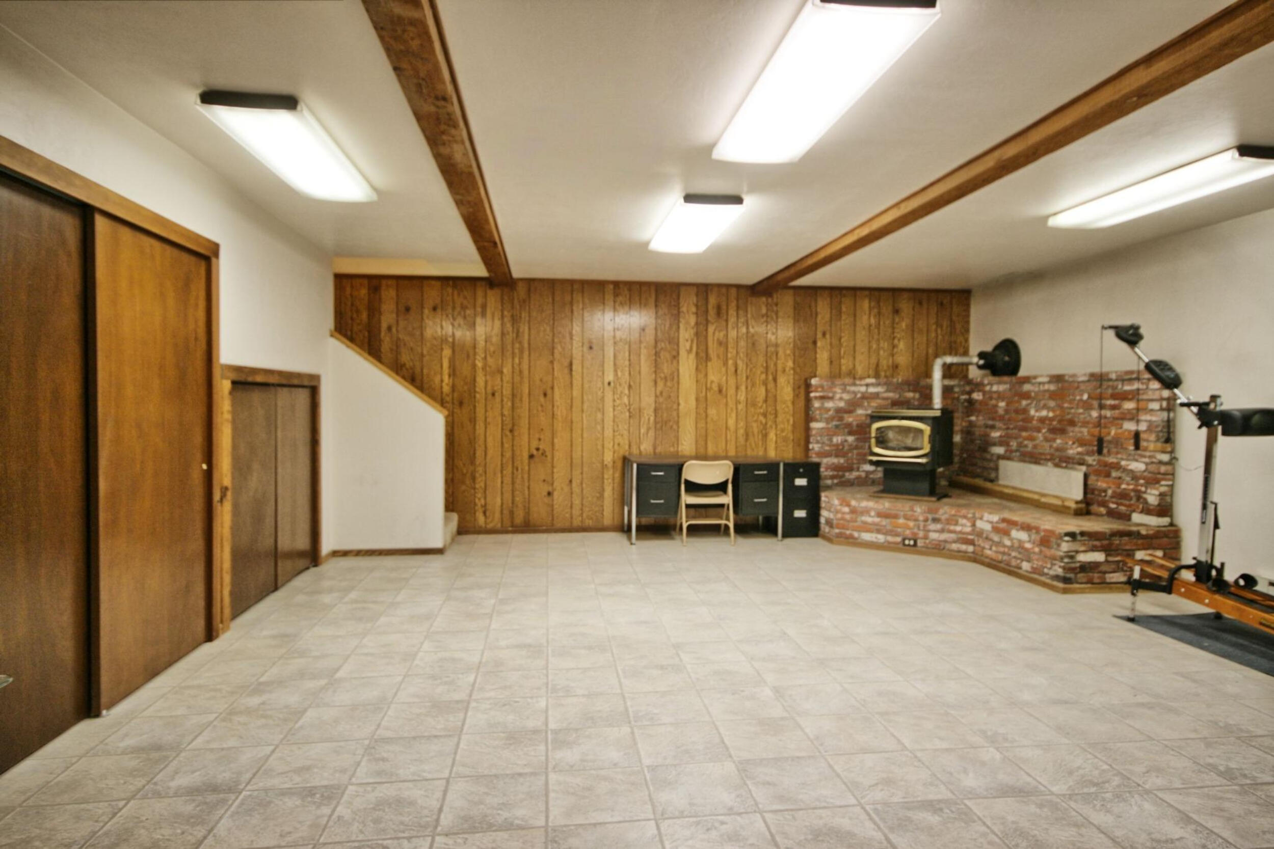 939 Beaver Creek Road Jacksonville, OR 97530 - Photo 35 of 53 lower level storage & stove heat