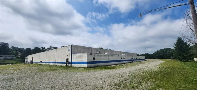 a view of a big house with a big yard and a small yard