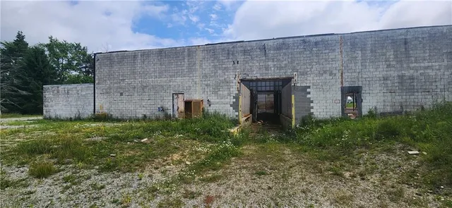 a brick building with a yard