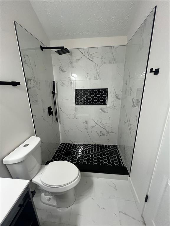3715 Cress Way Drive Decatur, GA 30034 - Photo 22 of 37 a bathroom with a toilet and a shower