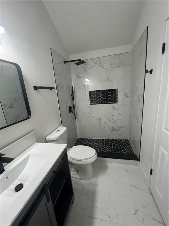 3715 Cress Way Drive Decatur, GA 30034 - Photo 23 of 37 a bathroom with a sink toilet and shower