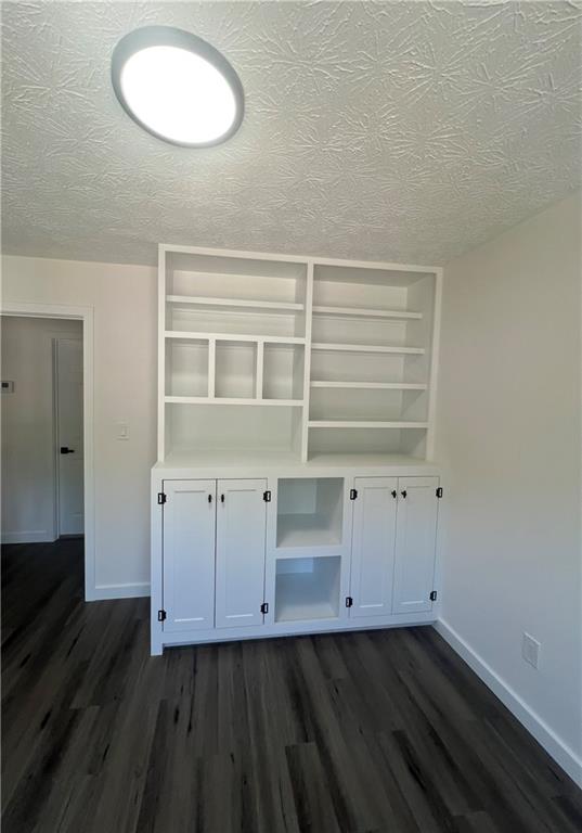 3715 Cress Way Drive Decatur, GA 30034 - Photo 27 of 37 an empty room with wooden floor and cabinet