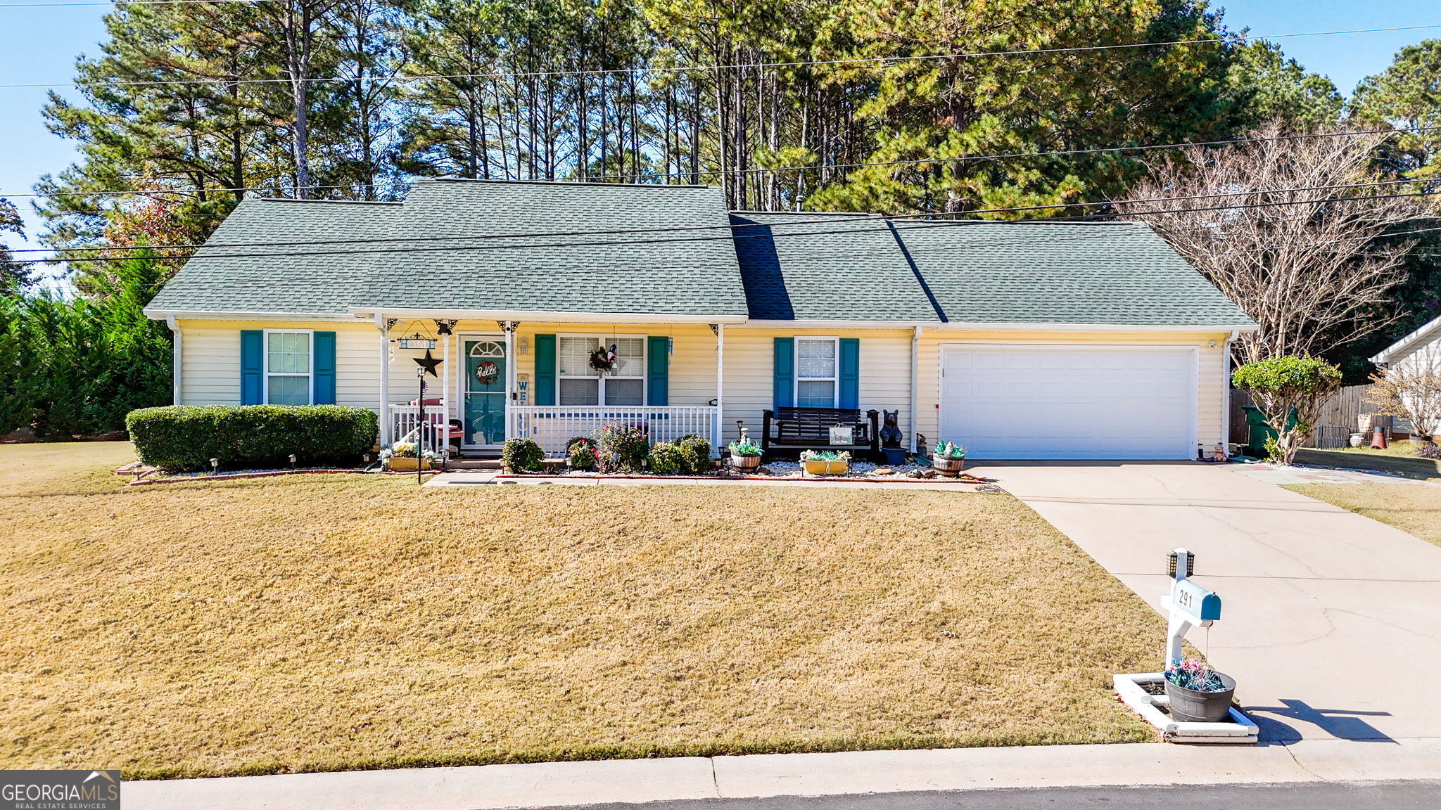 a view of a house with snow on the road