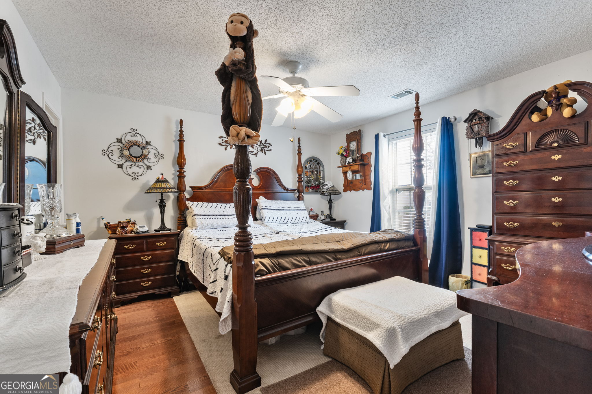 291 Regal Road Jackson, GA 30233 - Photo 12 of 35 a bedroom with a bed and a chandelier