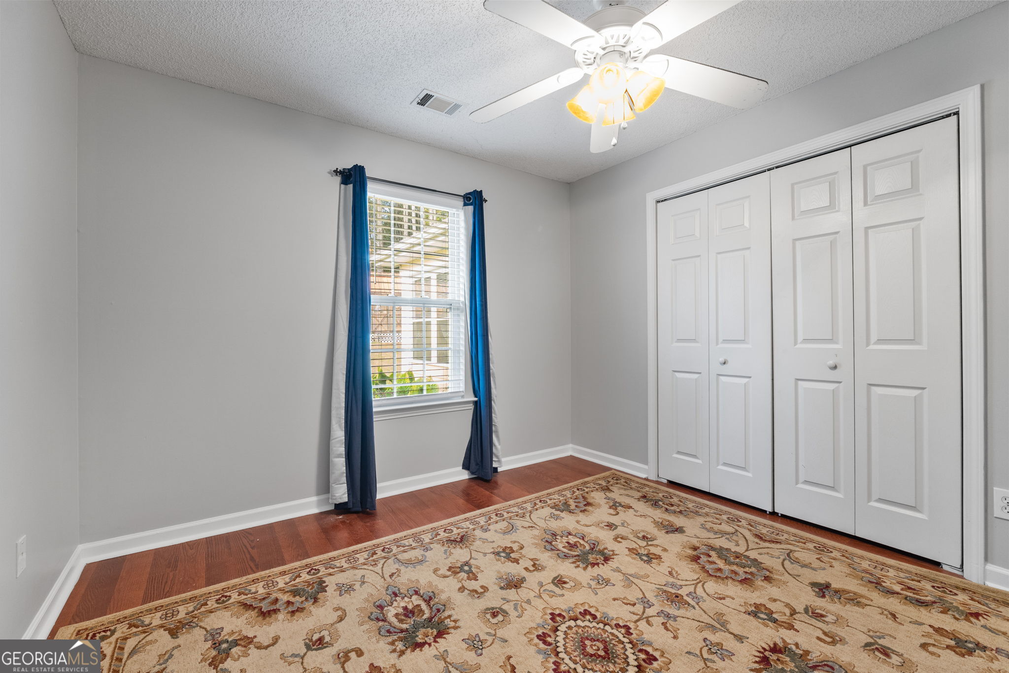291 Regal Road Jackson, GA 30233 - Photo 17 of 35 a bedroom with a bed and a window