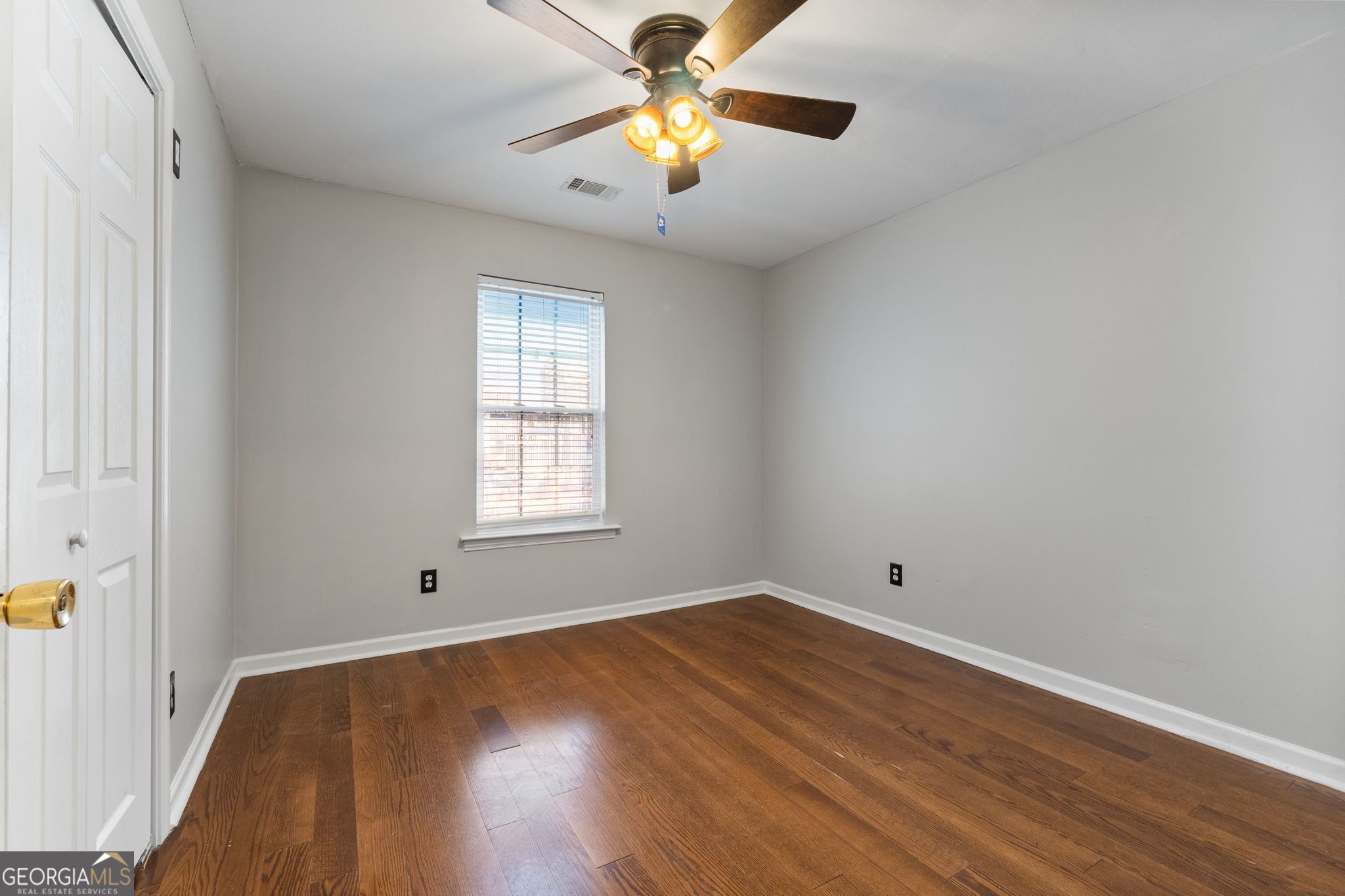 291 Regal Road Jackson, GA 30233 - Photo 20 of 35 wooden floor in an empty room with a window