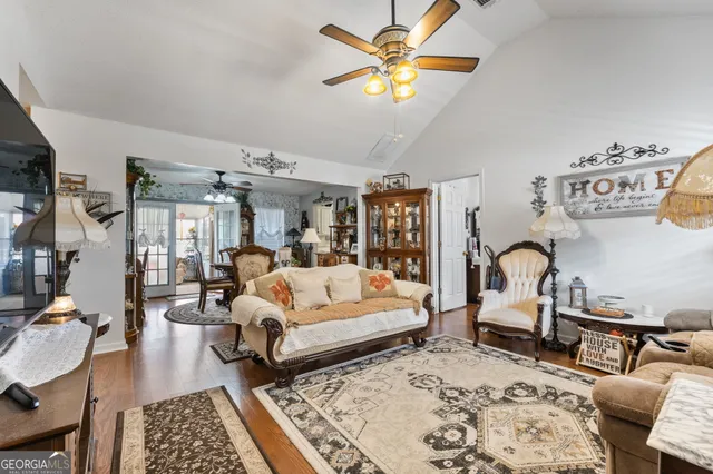a living room with furniture and a rug