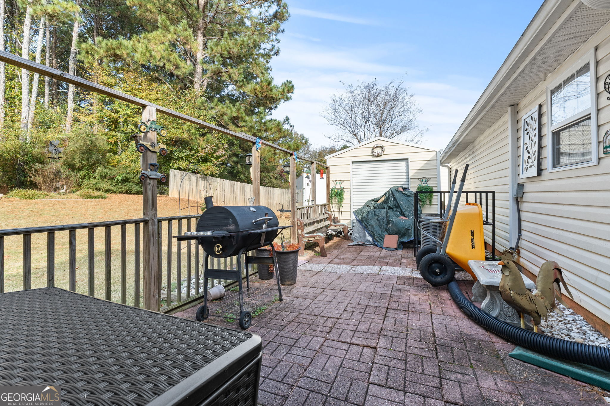 291 Regal Road Jackson, GA 30233 - Photo 24 of 35 a view of a patio with a table and chairs