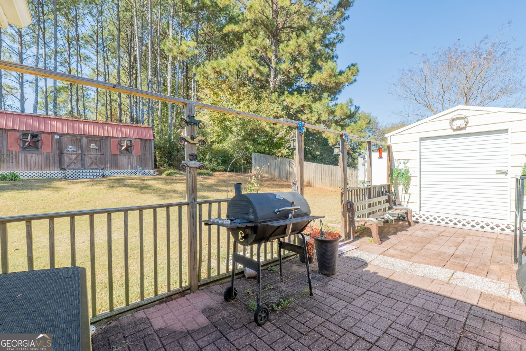 291 Regal Road Jackson, GA 30233 - Photo 25 of 35 a view of a chairs and table in the patio